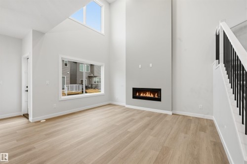 3036 Dixon Landing Landing, Edmonton, AB - Indoor Photo Showing Living Room With Fireplace