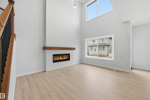 3230 Dixon Way, Edmonton, AB - Indoor Photo Showing Living Room With Fireplace