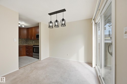 Dining area with plenty of room for table and chairs with sliding patio door into your backyard - 221 Callingwood Place, Edmonton, AB - Indoor