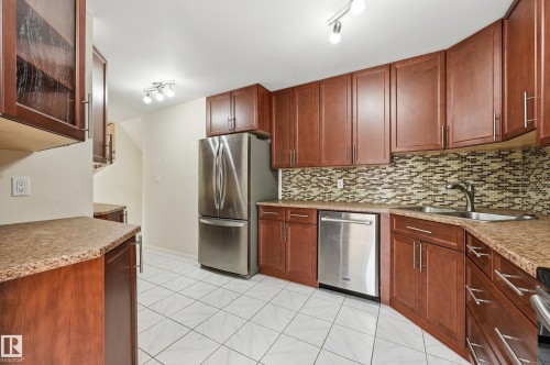 upgraded kitchen includes matching stainless steel appliances - 221 Callingwood Place, Edmonton, AB - Indoor Photo Showing Kitchen With Stainless Steel Kitchen With Double Sink