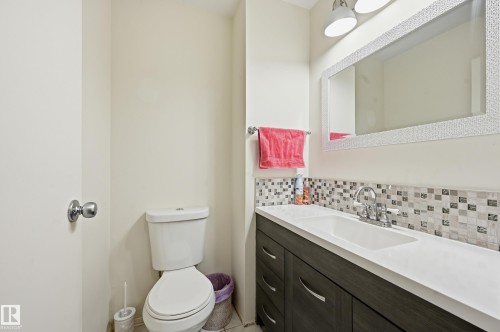 2 piece bathroom on the main floor - 221 Callingwood Place, Edmonton, AB - Indoor Photo Showing Bathroom