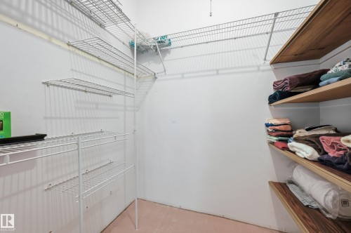Spacious closet at the top of the stairs for storage, linens etc - 221 Callingwood Place, Edmonton, AB - Indoor With Storage