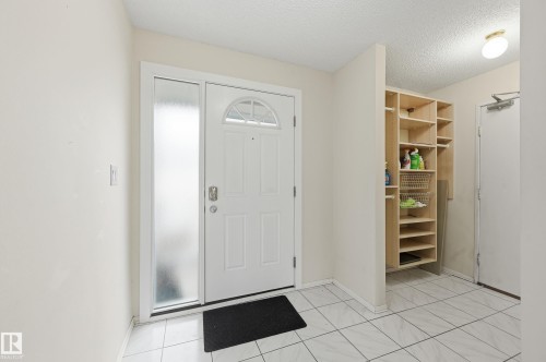 Front entry, with storage closet as well as entrance to your garage - 221 Callingwood Place, Edmonton, AB - Indoor Photo Showing Other Room