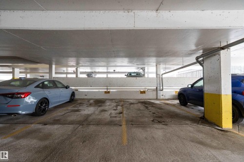 2 Assigned, secured stalls - 1405 10149 Saskatchewan Drive, Edmonton, AB - Indoor Photo Showing Garage
