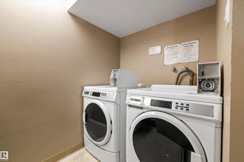 Laundry machines on every level - 1405 10149 Saskatchewan Drive, Edmonton, AB - Indoor Photo Showing Laundry Room