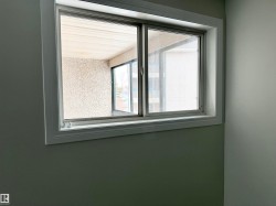 Window with white trim and a view of the exterior building - 