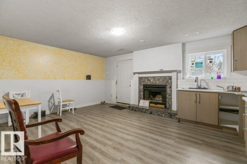 3132 49A Street, Edmonton, AB - Indoor Photo Showing Living Room With Fireplace