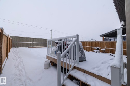 The property features a fenced yard with a deck - 159 Larch Crescent, Leduc, AB - Outdoor With Exterior