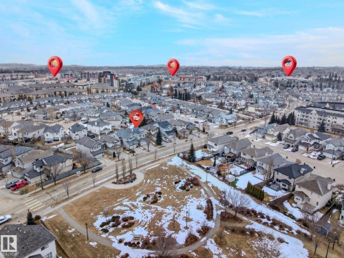 An aerial view showcasing the property within a community of residential homes and apartment buildings - 978 Rutherford Road Sw, Edmonton, AB - Outdoor With View