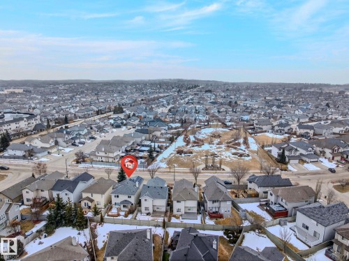 Aerial view of the property, located in a residential area with a park space visible - 978 Rutherford Road Sw, Edmonton, AB - Outdoor With View