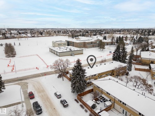 This property is located within a community featuring green spaces and other structures - 3311 139 Avenue, Edmonton, AB - Outdoor With View