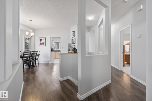 The property features dark wood-style flooring throughout, with light grey walls and white trim - 17204 113 Street, Edmonton, AB - Indoor