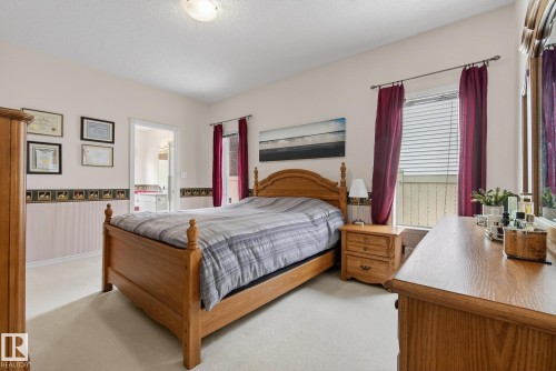 The property features a bedroom with light-colored walls and soft carpeting - 17204 113 Street, Edmonton, AB - Indoor Photo Showing Bedroom