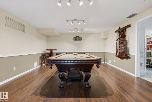 Finished lower level featuring hardwood flooring, recessed lighting, and a pool table - 17204 113 Street, Edmonton, AB - Indoor Photo Showing Other Room