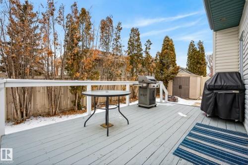 Outdoor deck with white railings, a shed, and a privacy fence - 17204 113 Street, Edmonton, AB - Outdoor With Deck Patio Veranda