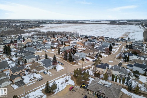 Aerial view of the neighborhood, showcasing residential properties with varying roof styles and a distant field - 17204 113 Street, Edmonton, AB - Outdoor With View
