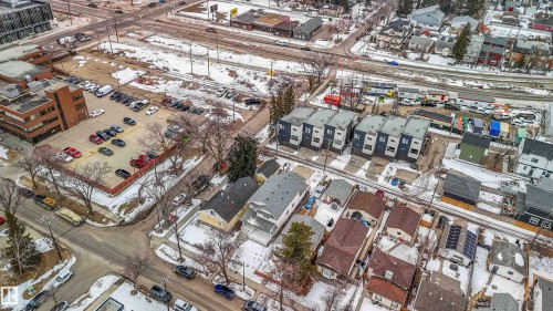 Aerial view showcasing a residential area with various property styles, including detached homes and multi-unit buildings - 10186 143 Street, Edmonton, AB - 
