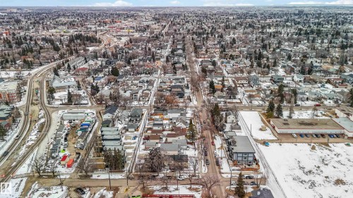 Aerial view showcasing the neighborhood, featuring an extensive network of streets and a wide array of residential buildings - 10186 143 Street, Edmonton, AB - Outdoor With View