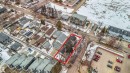 Aerial view of the property, highlighted in red, situated within a neighborhood featuring a mix of residential structures and commercial lots - 10186 143 Street, Edmonton, AB  -  