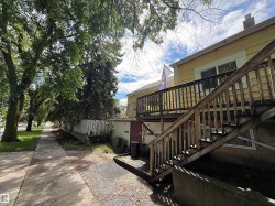 Exterior siding with an elevated wooden deck and staircase - 