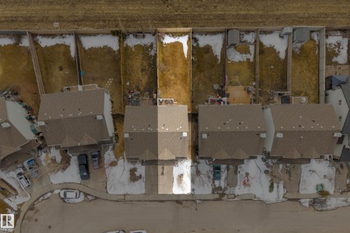 Aerial view of the property with a brown shingled roof and a paved driveway - 9051 Scott Crescent, Edmonton, AB - Indoor Photo Showing Other Room