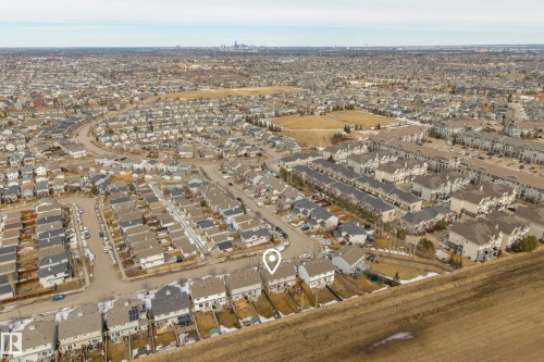 Aerial view of the residential area with a prominent skyline visible in the distance - 9051 Scott Crescent, Edmonton, AB - Outdoor With View