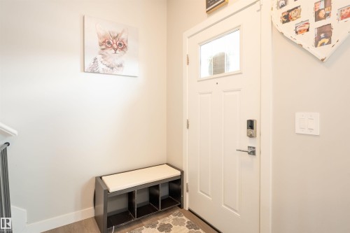 Entryway featuring light-colored walls and a white paneled door with a clear glass insert - 656 Black Stone, Leduc, AB - Indoor Photo Showing Other Room