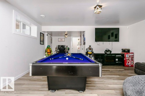 Recreational space featuring light-toned flooring, a pool table with a blue felt surface, and white walls - 320 Balsam Link, Leduc, AB - Indoor Photo Showing Other Room