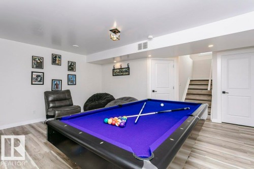 Recreational space featuring a pool table, light wood-style flooring, and recessed lighting - 320 Balsam Link, Leduc, AB - Indoor Photo Showing Other Room