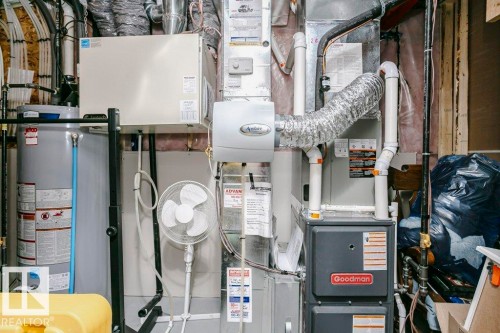 The property includes a Goodman furnace and a water heater, ensuring essential utilities are in place - 320 Balsam Link, Leduc, AB - Indoor Photo Showing Basement