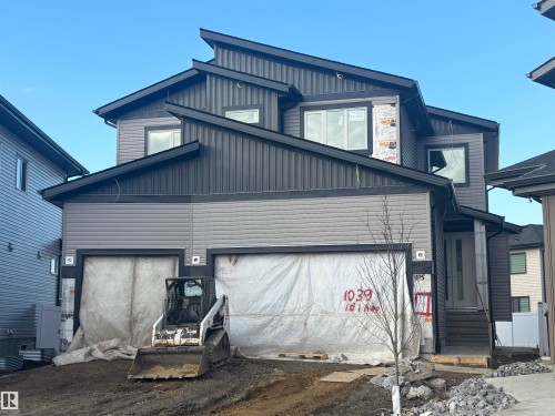 The property features a contemporary exterior with multi-toned siding and a striking roofline - 1039 151 Ave, Edmonton, AB - Outdoor