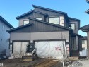 The property features a contemporary exterior with multi-toned siding and a striking roofline - 1039 151 Ave, Edmonton, AB  - Outdoor 