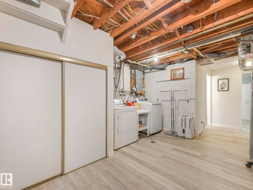 The property includes a dedicated laundry area with a washer and dryer, set on light-toned flooring - 16106 79A Avenue Nw, Edmonton, AB - Indoor Photo Showing Laundry Room