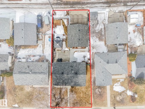 Aerial view showcasing the property's boundaries, two residential structures with gray roofs, and a concrete driveway - 16106 79A Avenue Nw, Edmonton, AB - Outdoor