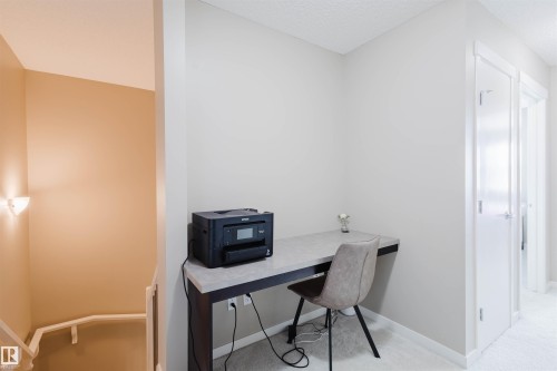 Dedicated work-from-home space featuring a built-in desk, light-colored walls, and carpeting - 16811 120 Street, Edmonton, AB - Indoor Photo Showing Office