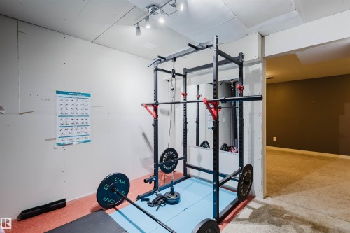 This versatile room offers an opportunity for a dedicated fitness area - 16811 120 Street, Edmonton, AB - Indoor Photo Showing Gym Room