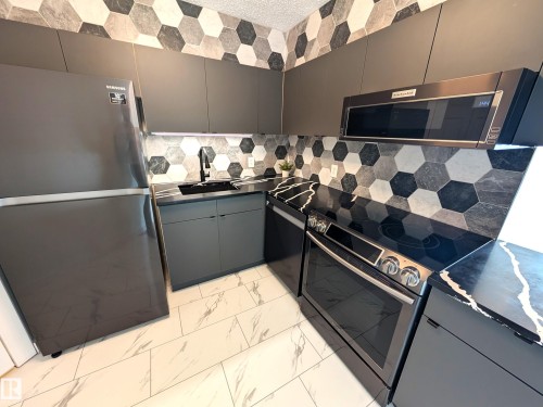 1307 10149 Saskatchewan Drive, Edmonton, AB - Indoor Photo Showing Kitchen With Upgraded Kitchen