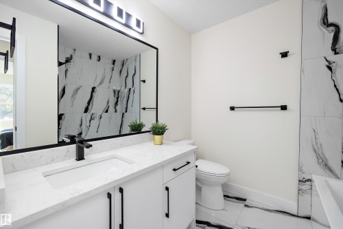 Main bathroom upstairs - 8319 81Ave, Edmonton, AB - Indoor Photo Showing Bathroom