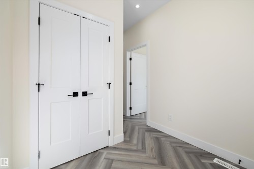 The interior features a clean aesthetic with light-colored walls and white trim - 8319 81Ave, Edmonton, AB - Indoor Photo Showing Other Room