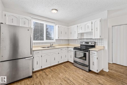 3119 144 Avenue, Edmonton, AB - Indoor Photo Showing Kitchen With Stainless Steel Kitchen With Double Sink