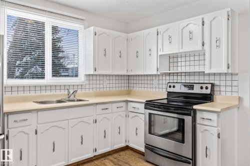 3119 144 Avenue, Edmonton, AB - Indoor Photo Showing Kitchen With Stainless Steel Kitchen With Double Sink