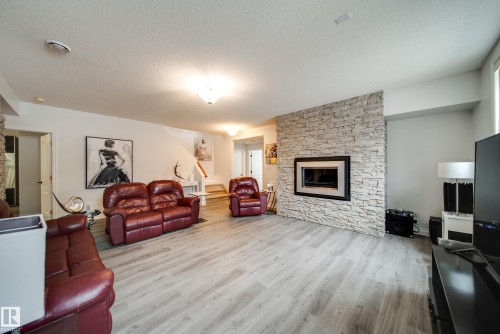 242 Running Creek Lane, Edmonton, AB - Indoor Photo Showing Living Room With Fireplace