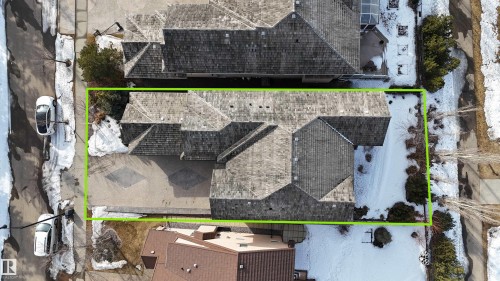 Aerial view of the property showcasing the roof, a patterned driveway, and surrounding grounds - 4016 Mactaggart Drive, Edmonton, AB - Outdoor