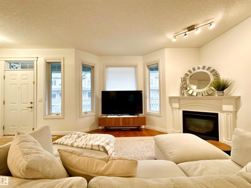 41 903 Rutherford Road, Edmonton, AB - Indoor Photo Showing Living Room With Fireplace