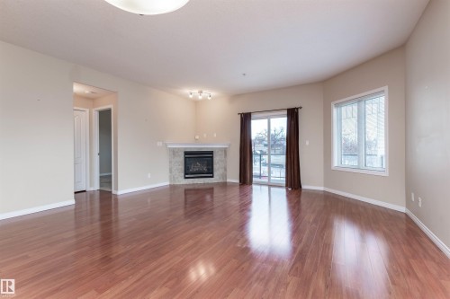 202 9905 81 Avenue, Edmonton, AB - Indoor Photo Showing Living Room With Fireplace