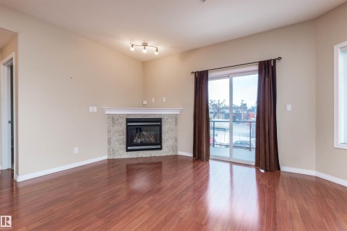202 9905 81 Avenue, Edmonton, AB - Indoor Photo Showing Living Room With Fireplace