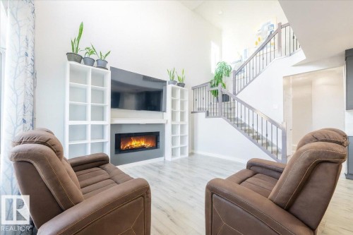 1035 Berg Place, Leduc, AB - Indoor Photo Showing Living Room With Fireplace