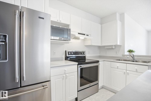 306 5116 49 Avenue, Leduc, AB - Indoor Photo Showing Kitchen With Double Sink