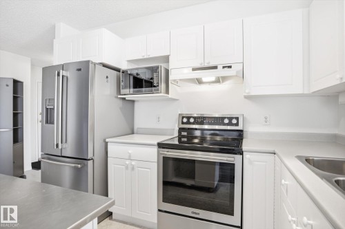306 5116 49 Avenue, Leduc, AB - Indoor Photo Showing Kitchen With Double Sink