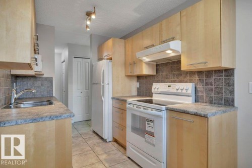 105 10149 83 Avenue, Edmonton, AB - Indoor Photo Showing Kitchen With Double Sink